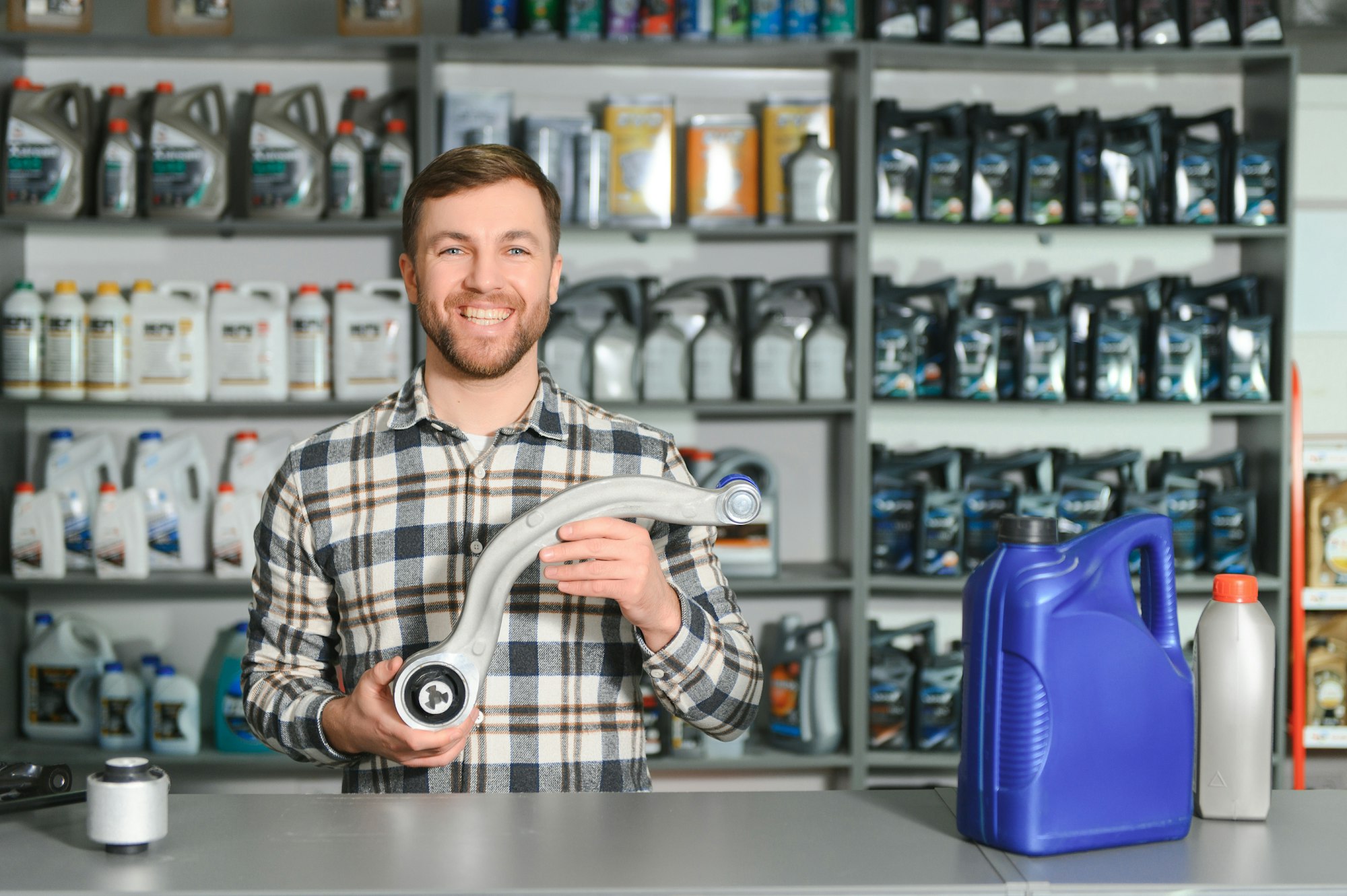 A salesman in an auto parts store. Retail trade of auto parts